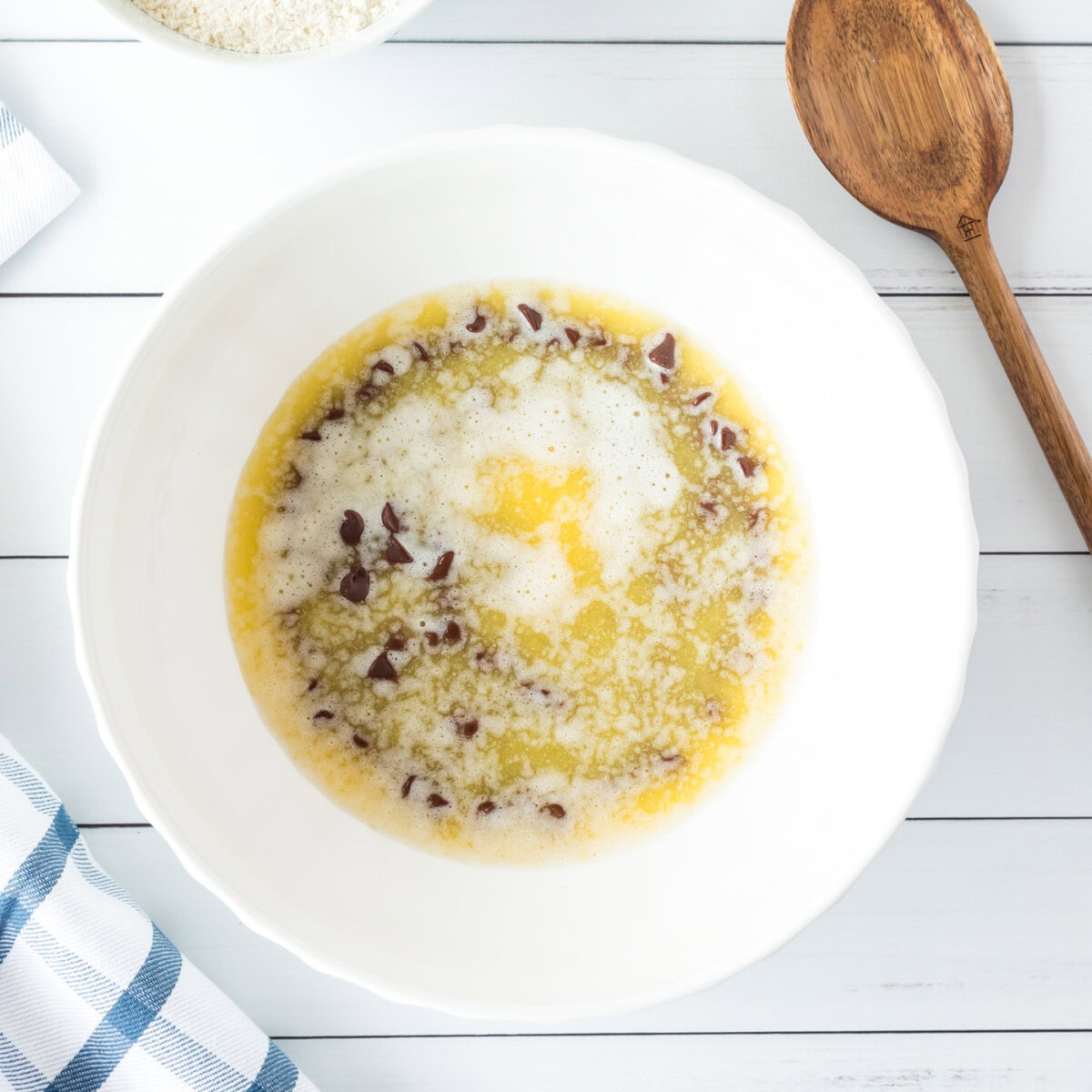 melted butter over chocolate chips in a bowl