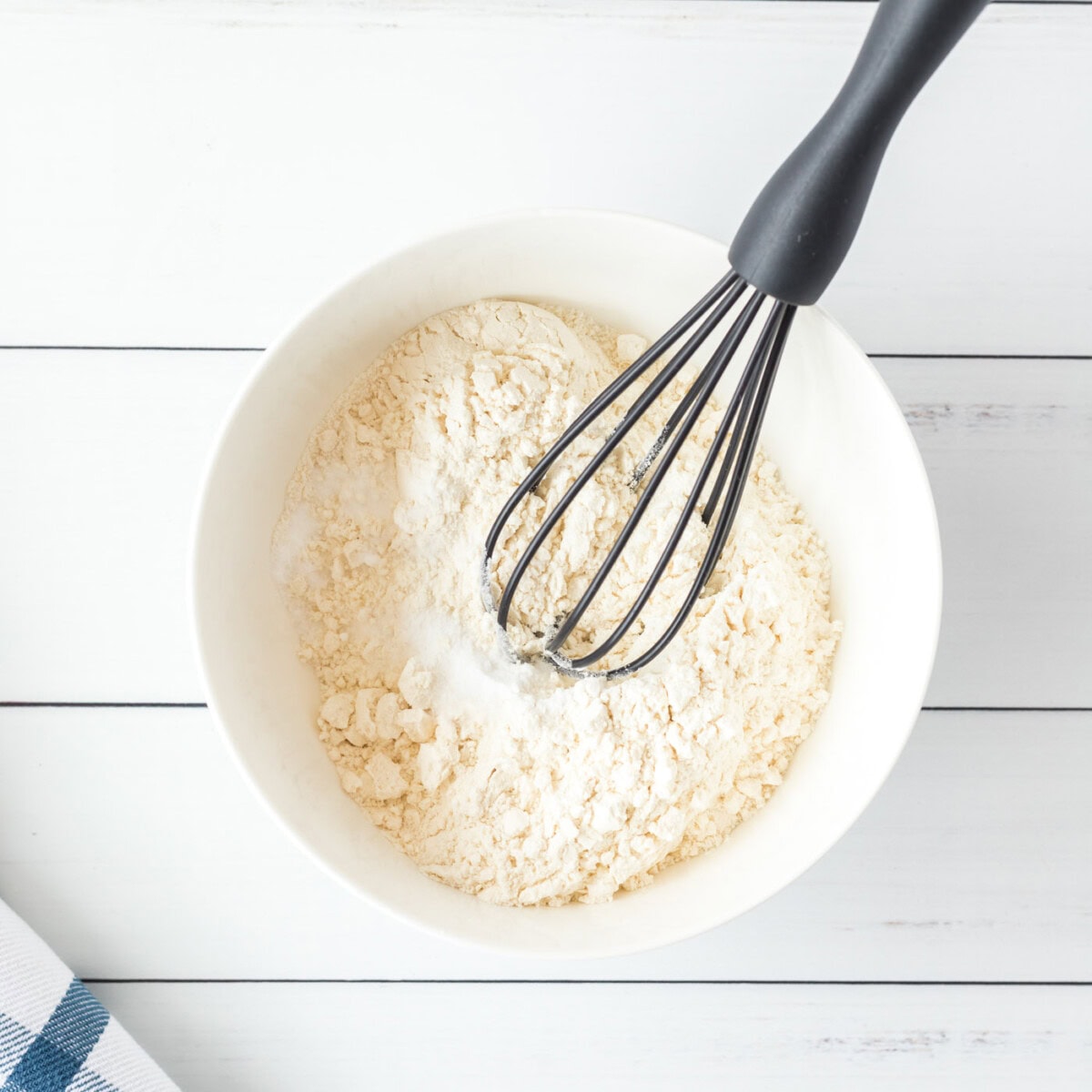 flour mixture in a bowl with a whisk