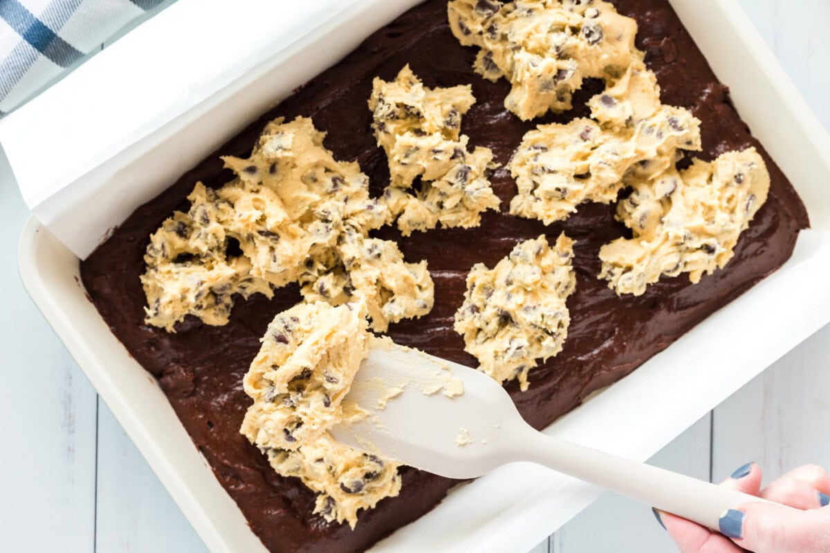 cookie dough dropped on top of brownie batter