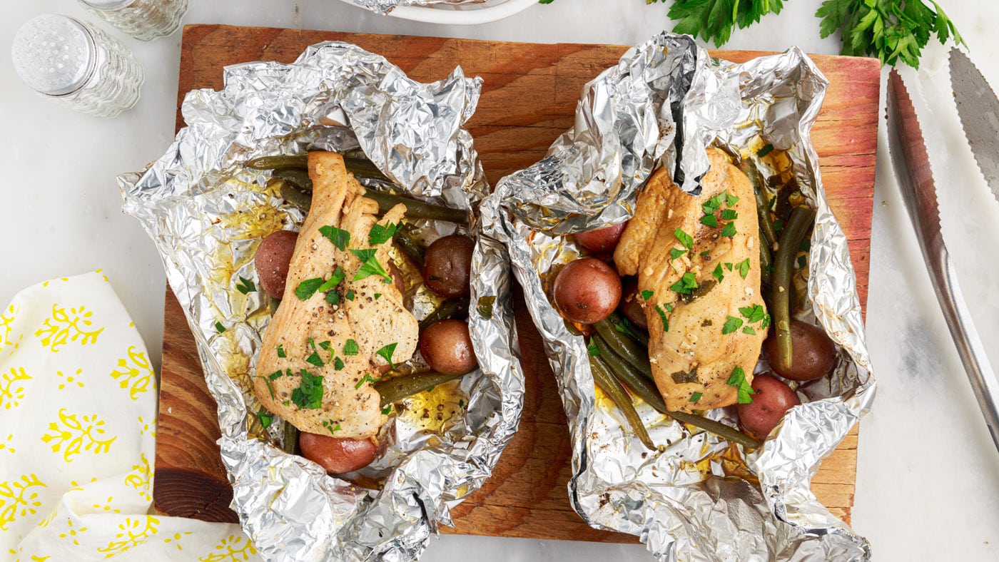 Simply toss the ingredients in a sealed foil packet and place on a grill grate over your campfire to