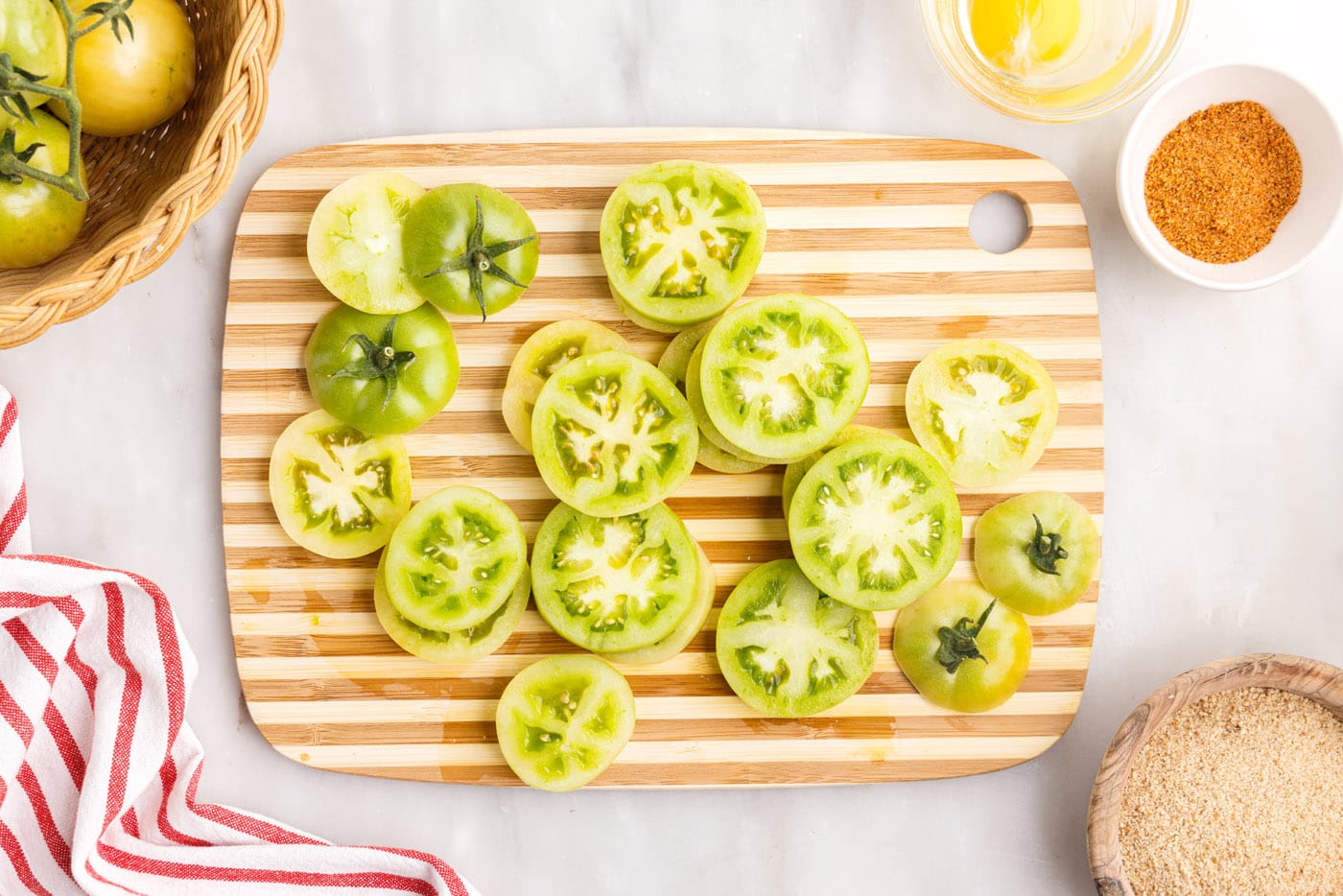 sliced green tomatoes on a cutting board