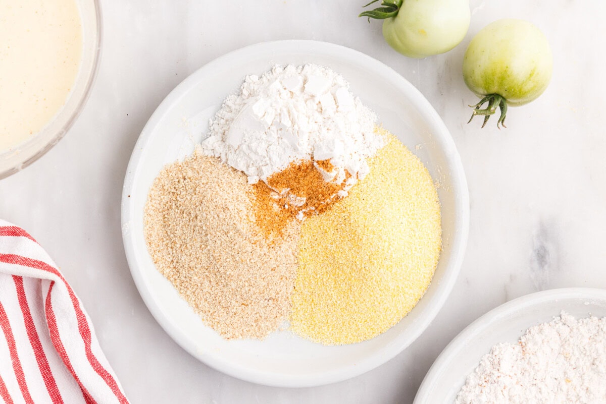 flour, cornmeal, cajun seasoning, and breadcrumbs for fried tomatoes