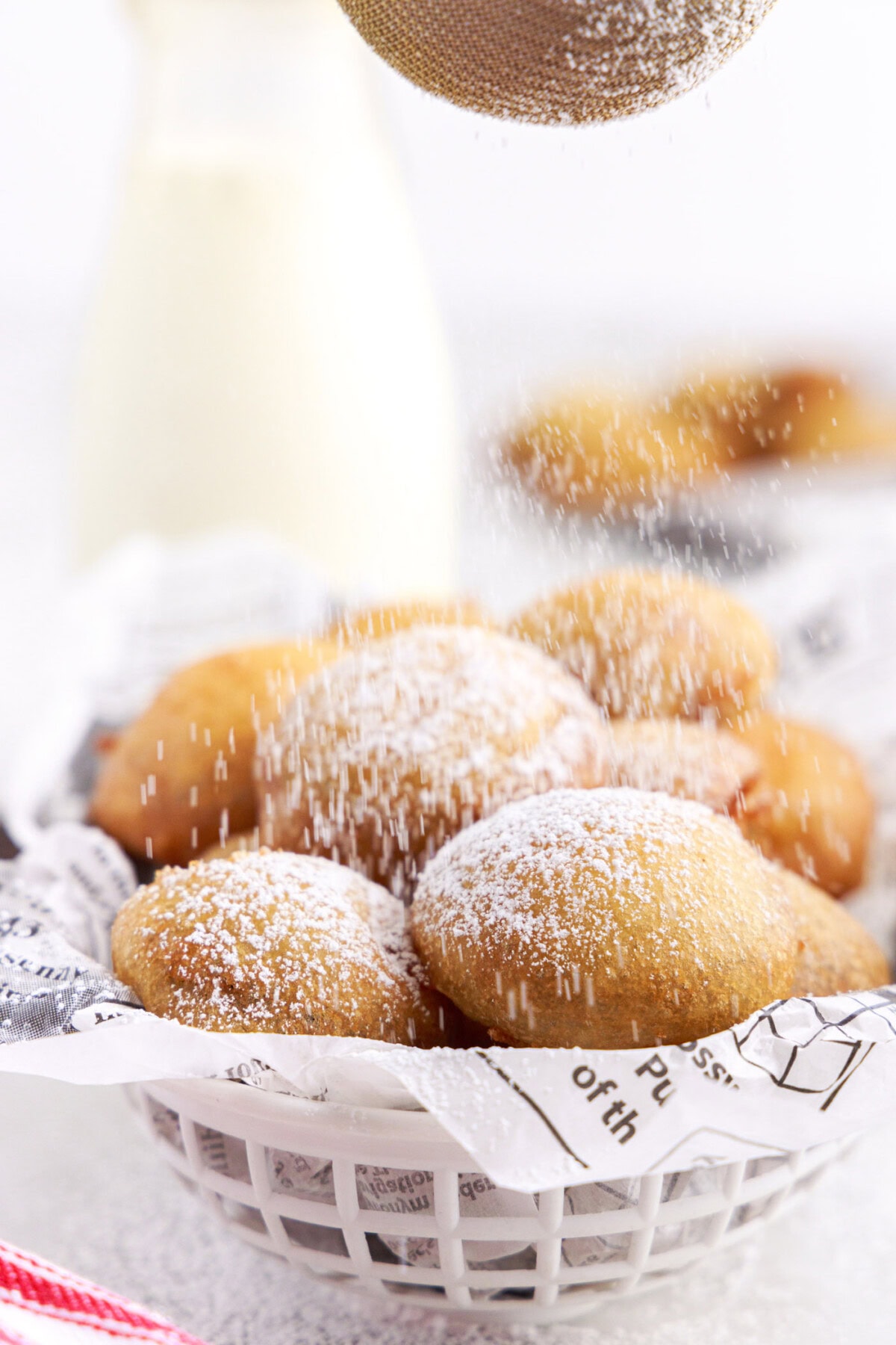 dusting Fried Oreos with powdered sugar