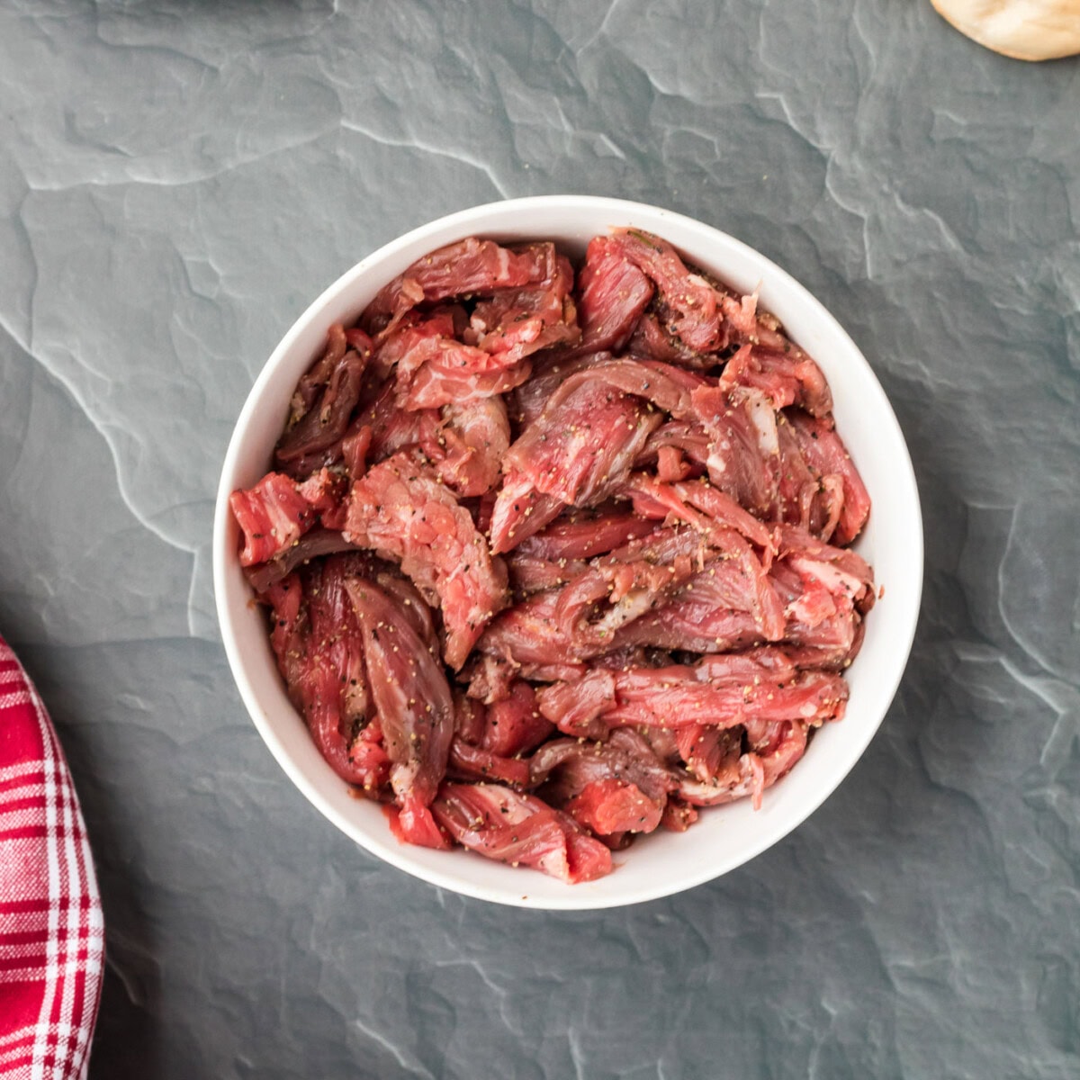 sliced flank steak in a bowl