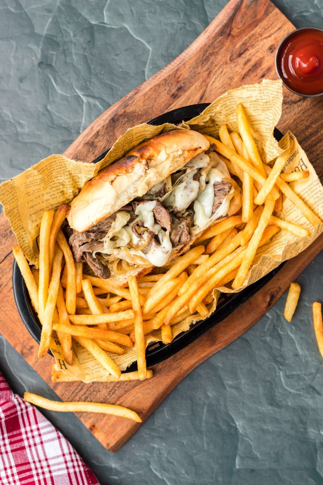 Philly Cheese Steak in basket with fries