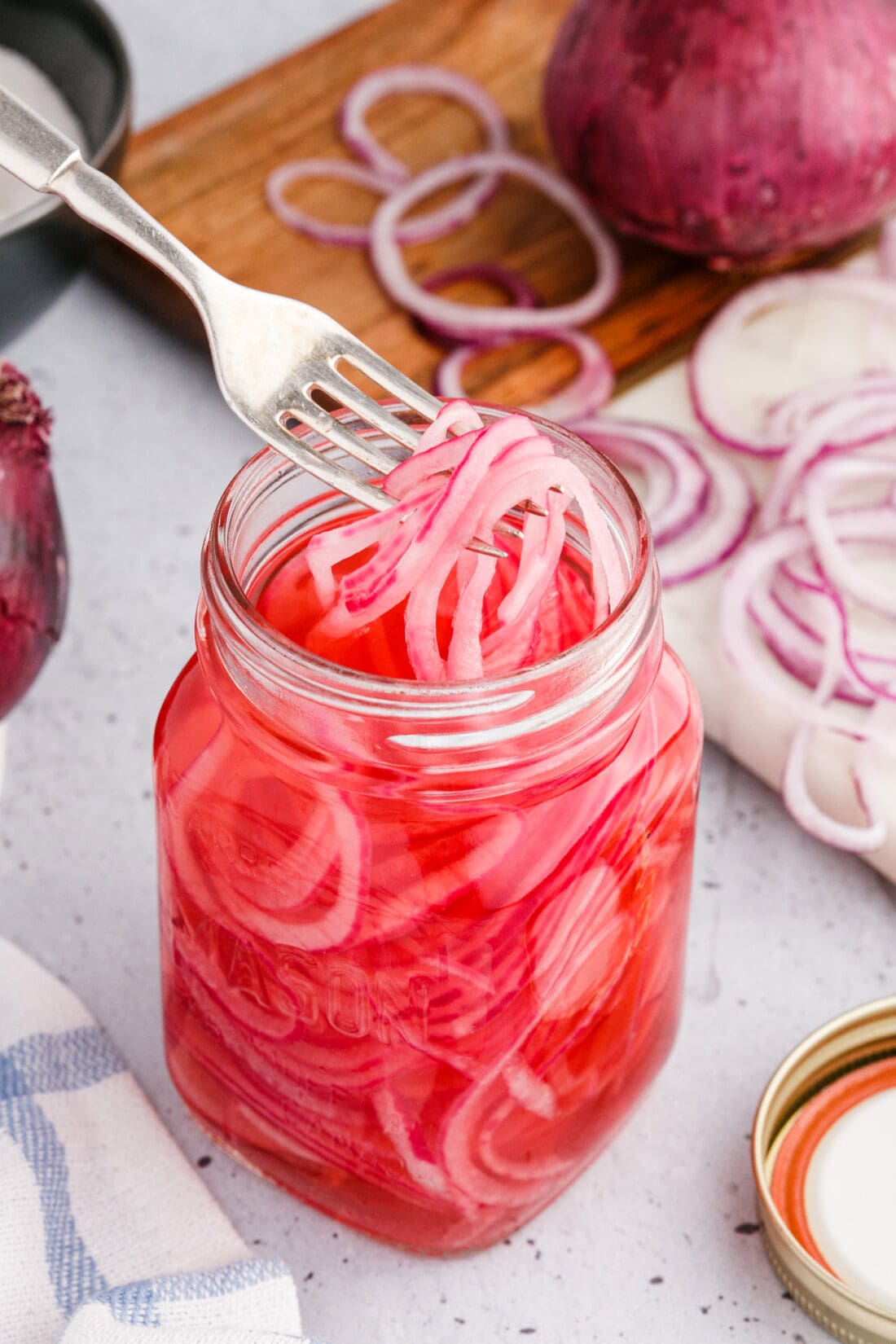 taking Pickled Onions out of jar with a fork