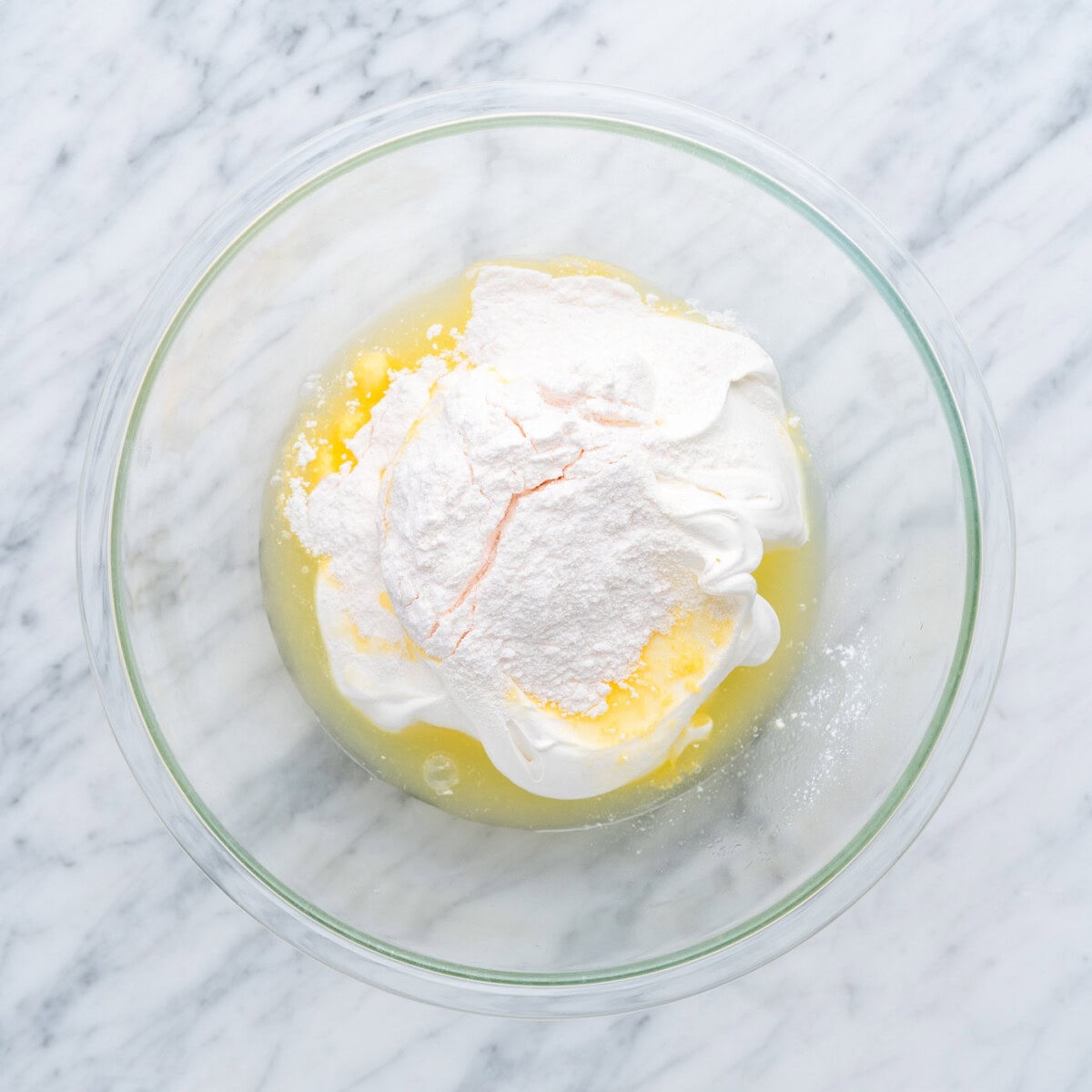 pineapple juice, whipped cream, and instant vanilla pudding mix in a bowl