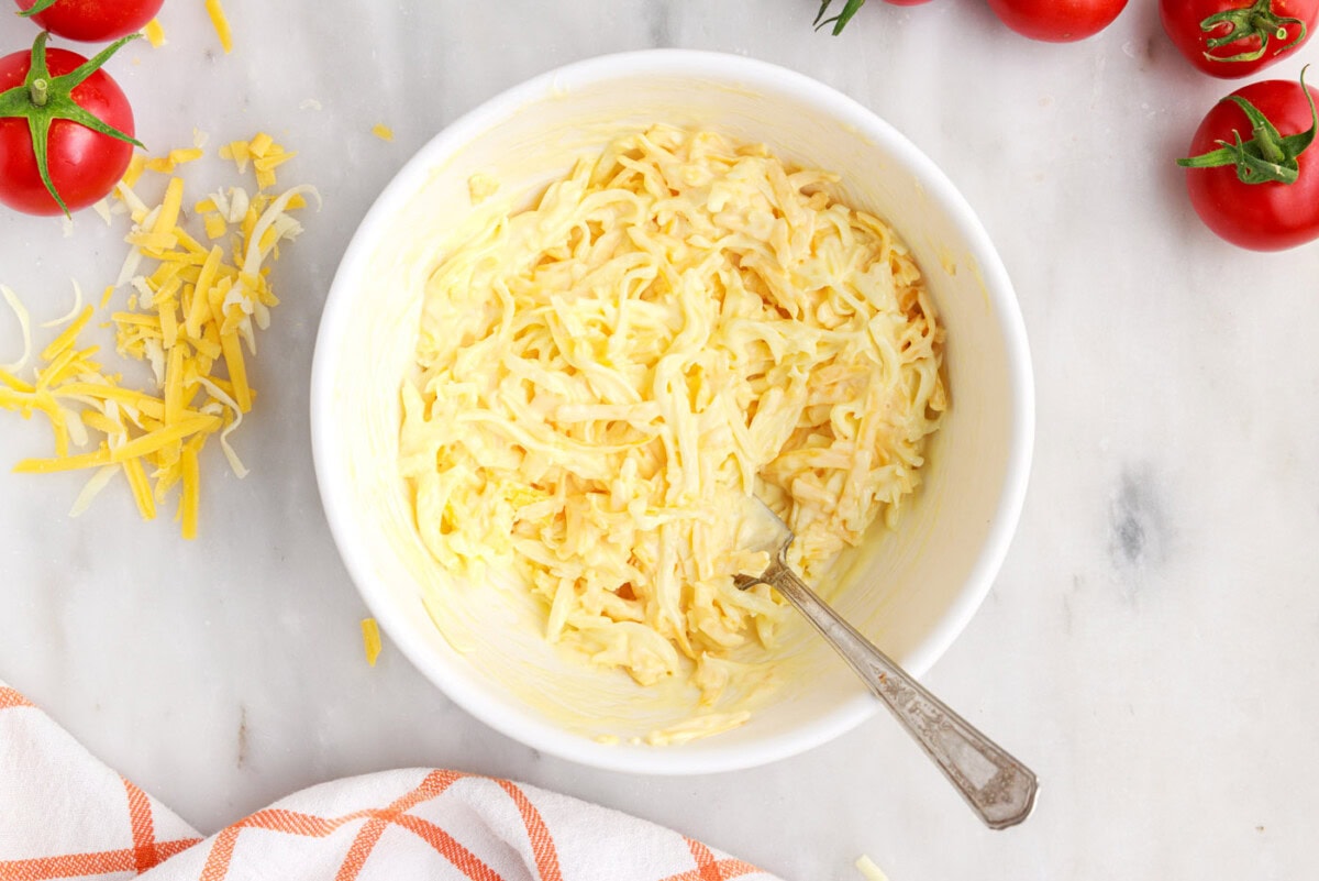 mayo egg and cheese mixed in a bowl