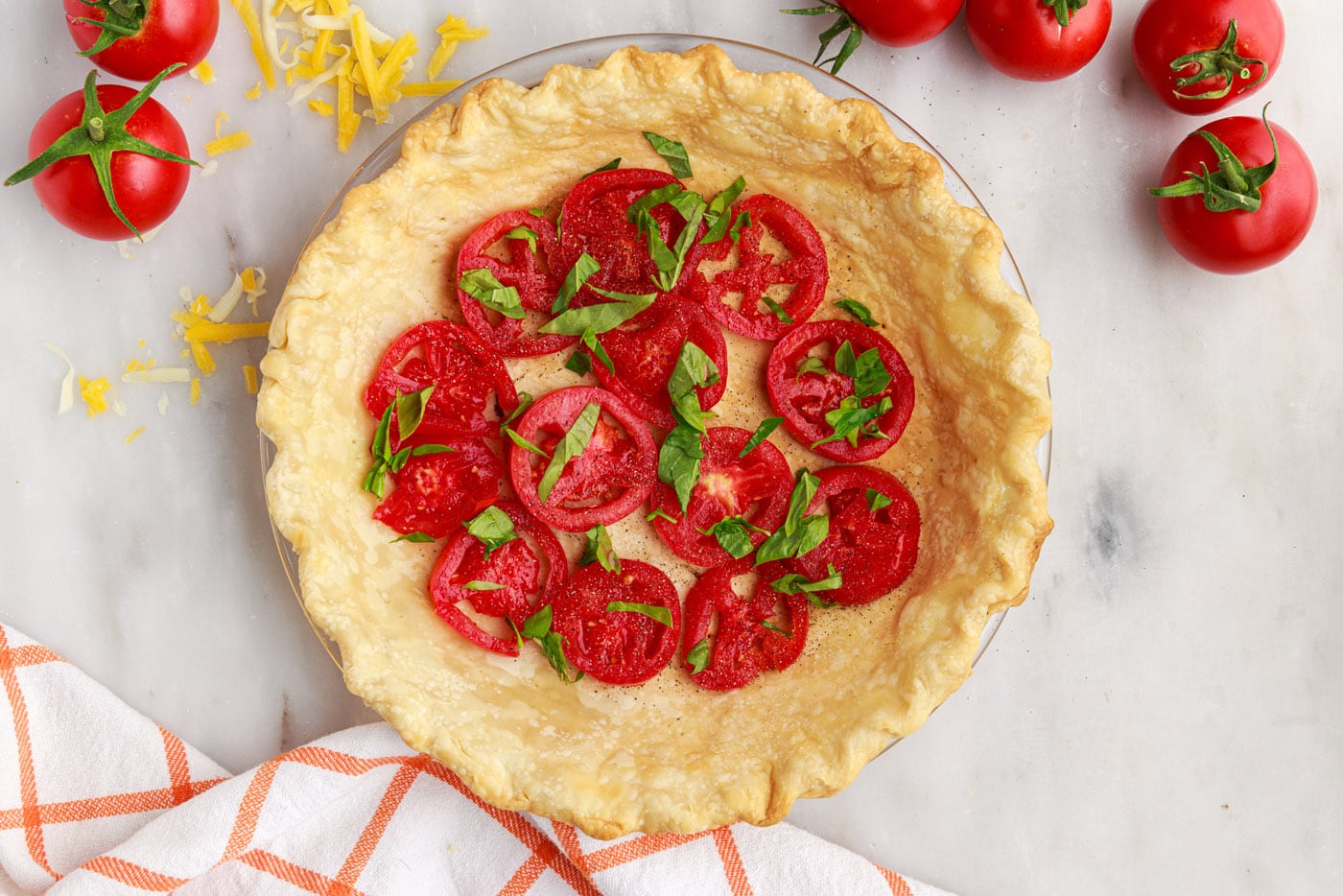 chopped basil on top of tomato pie