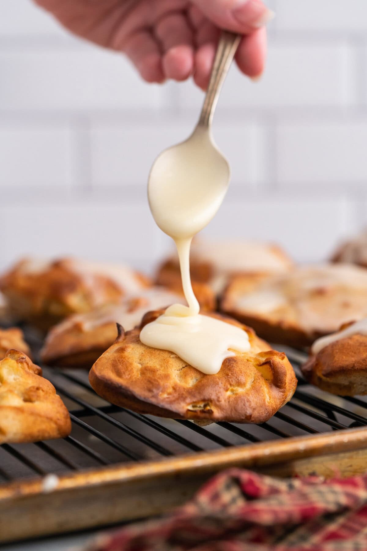 adding glaze to Air Fryer Apple Fritters