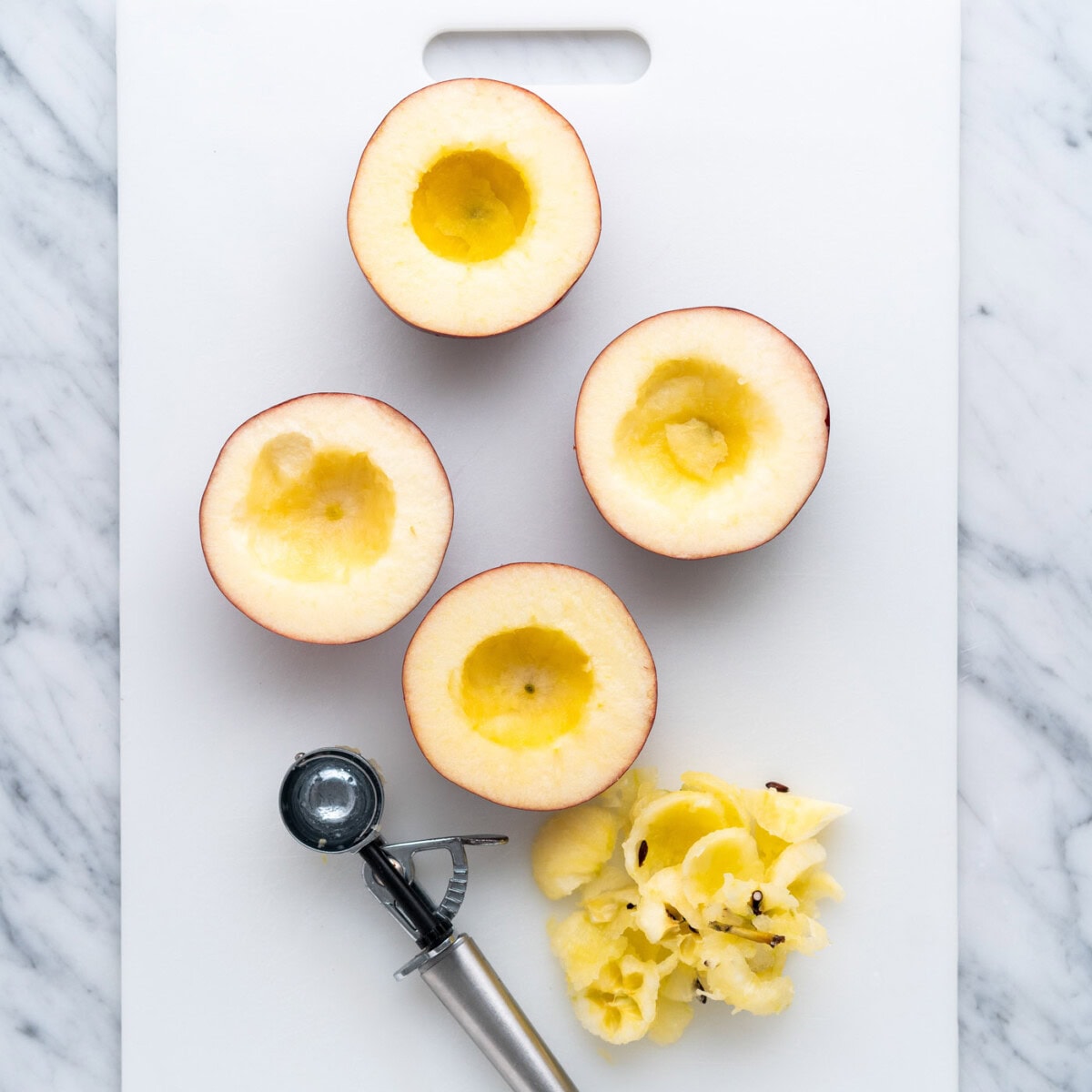 cored apple halves using a melon baller