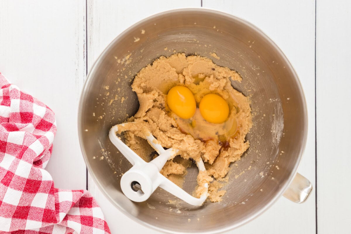 egg and vanilla added to batter in a bowl