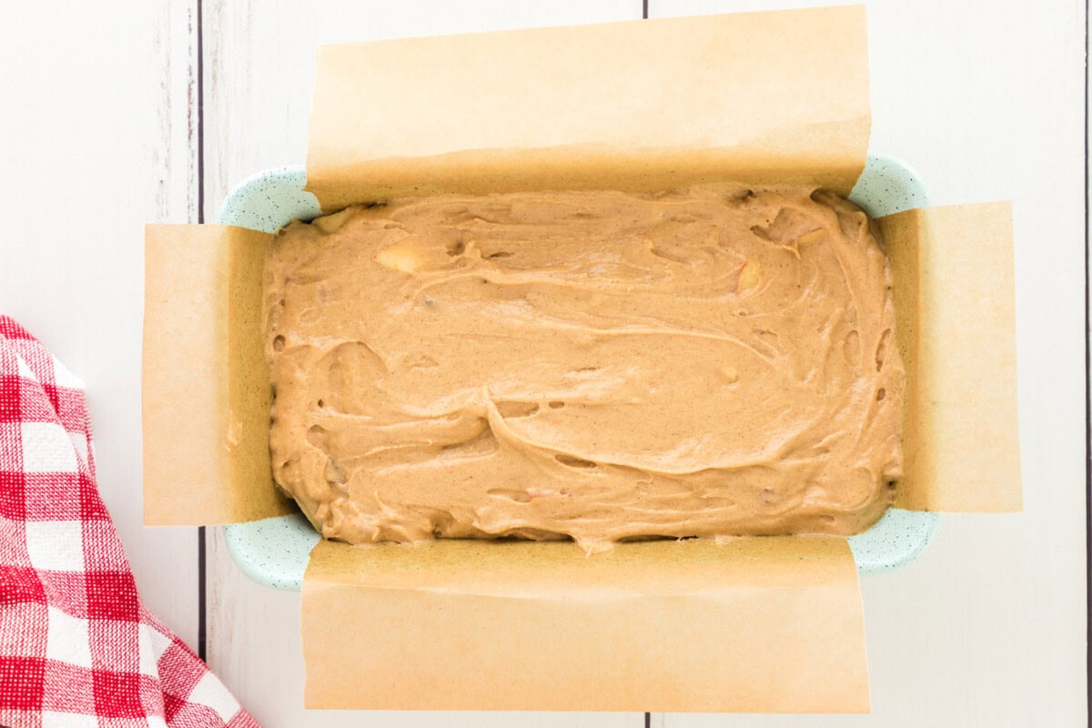apple bread batter in a loaf pan