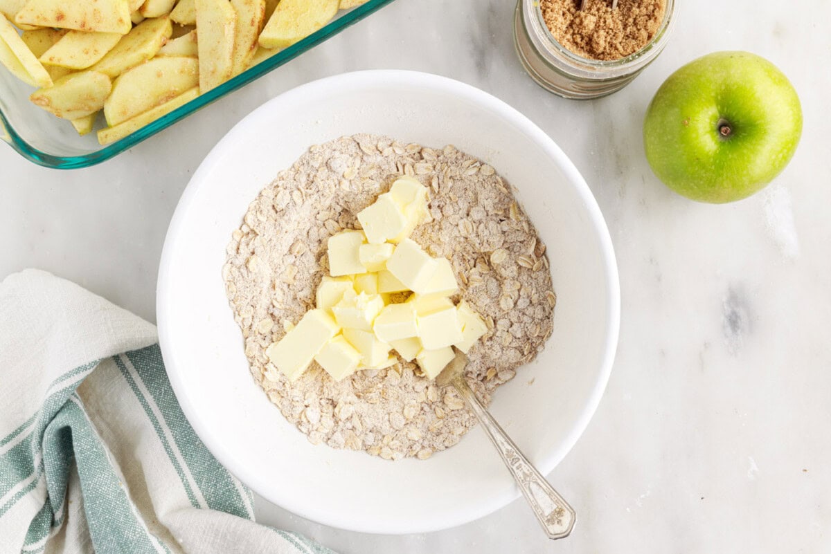 cubed butter in rolled oats mixture