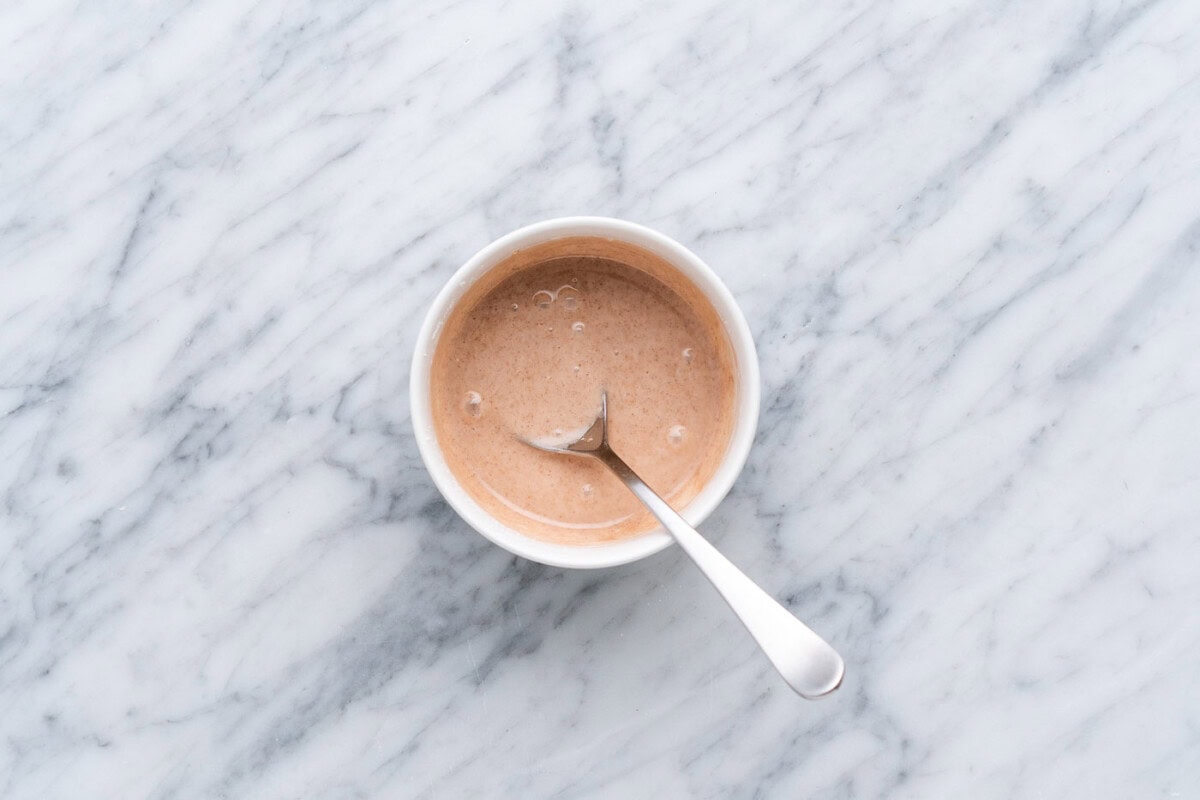 cinnamon glaze in a bowl with spoon