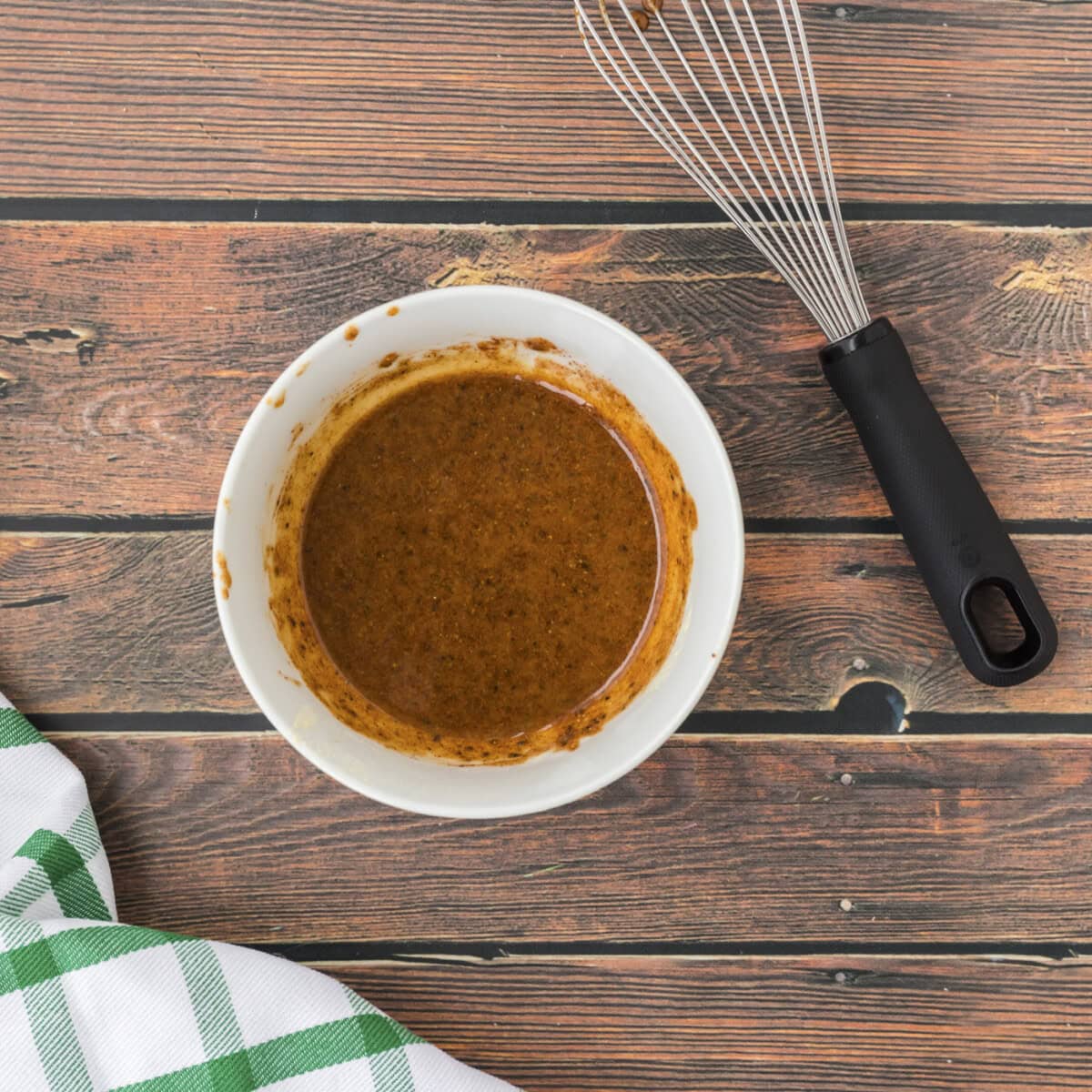 chicken leg seasoning mixture and a whisk