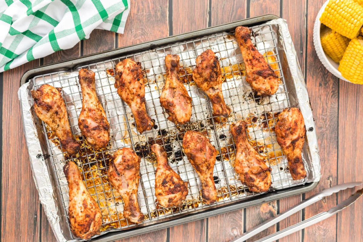 crispy baked chicken legs on a baking sheet
