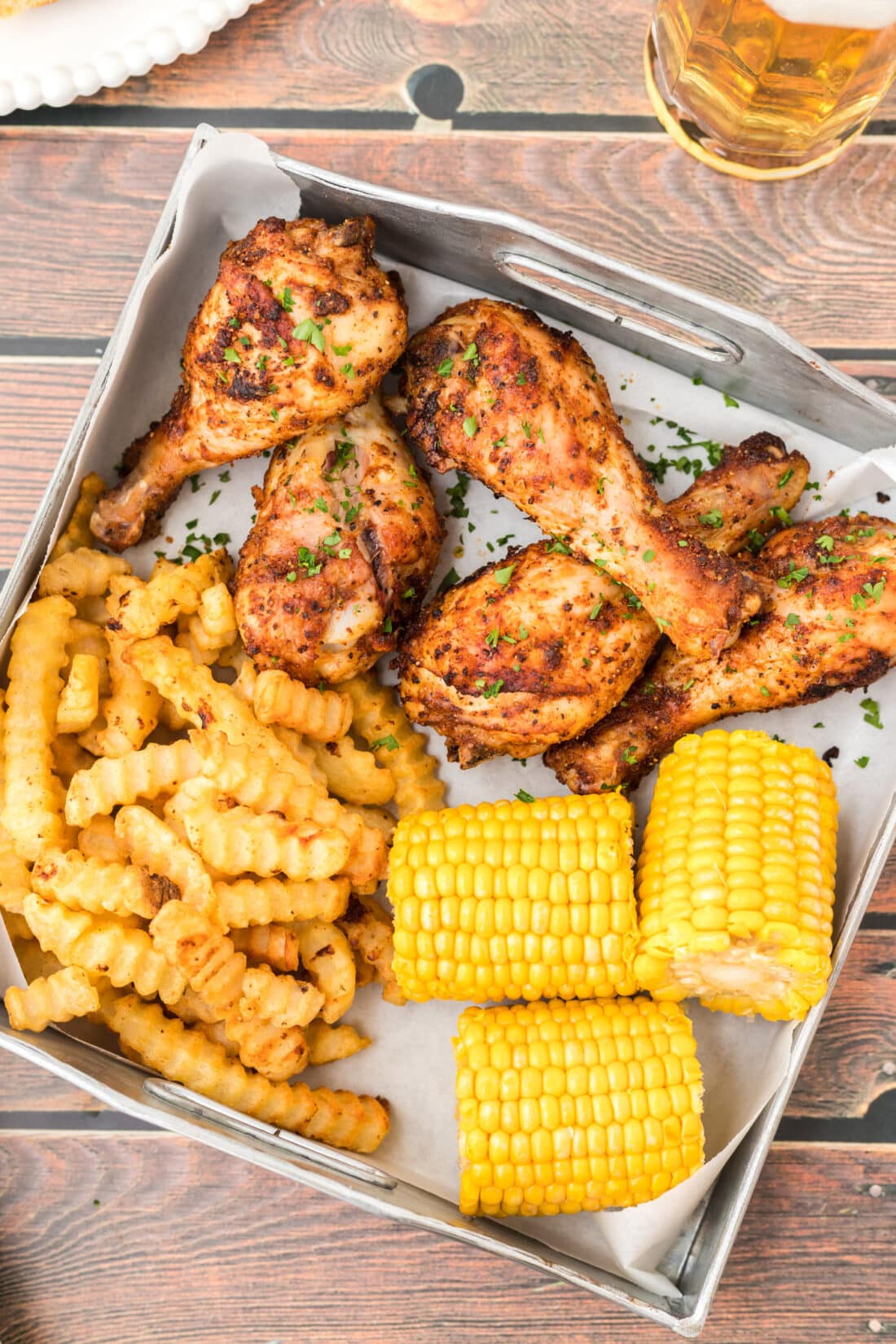Baked Chicken Legs with fries and corn