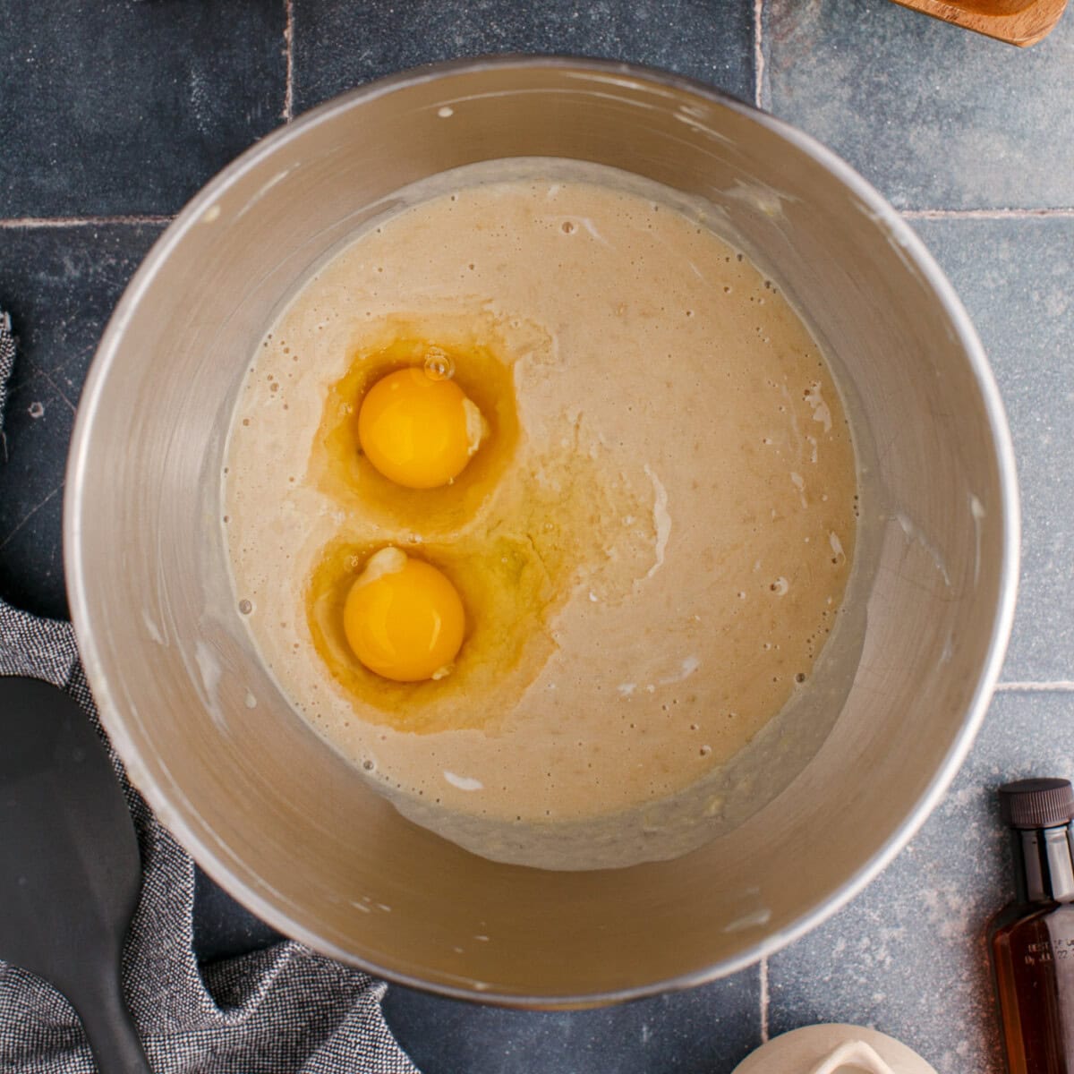 adding eggs to banana muffin batter