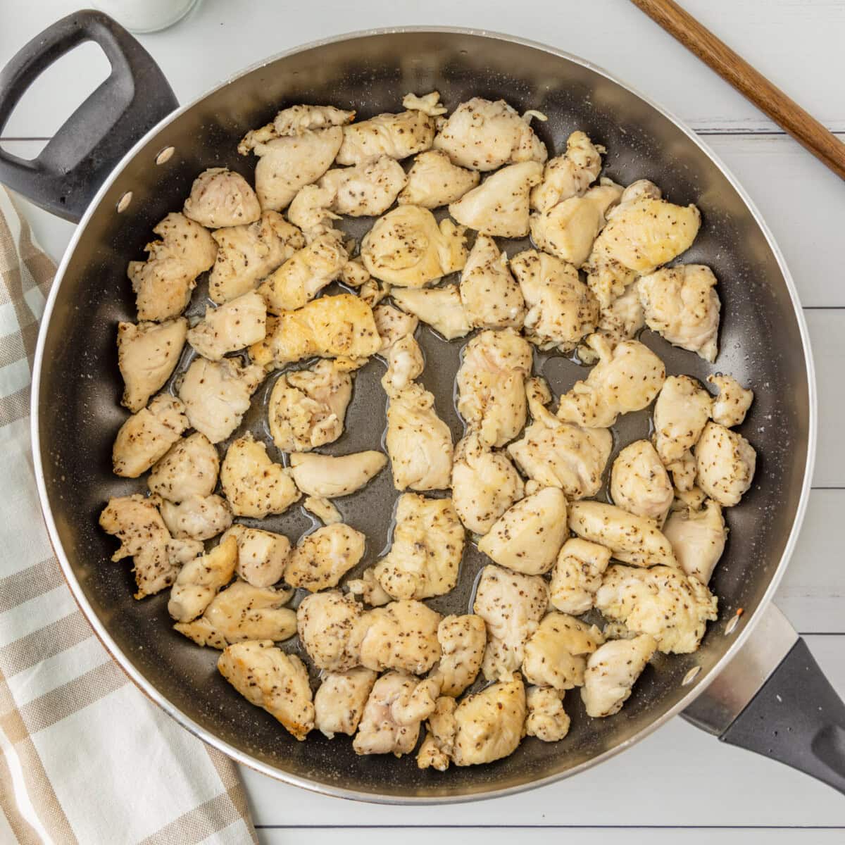 chicken cooking in a skillet