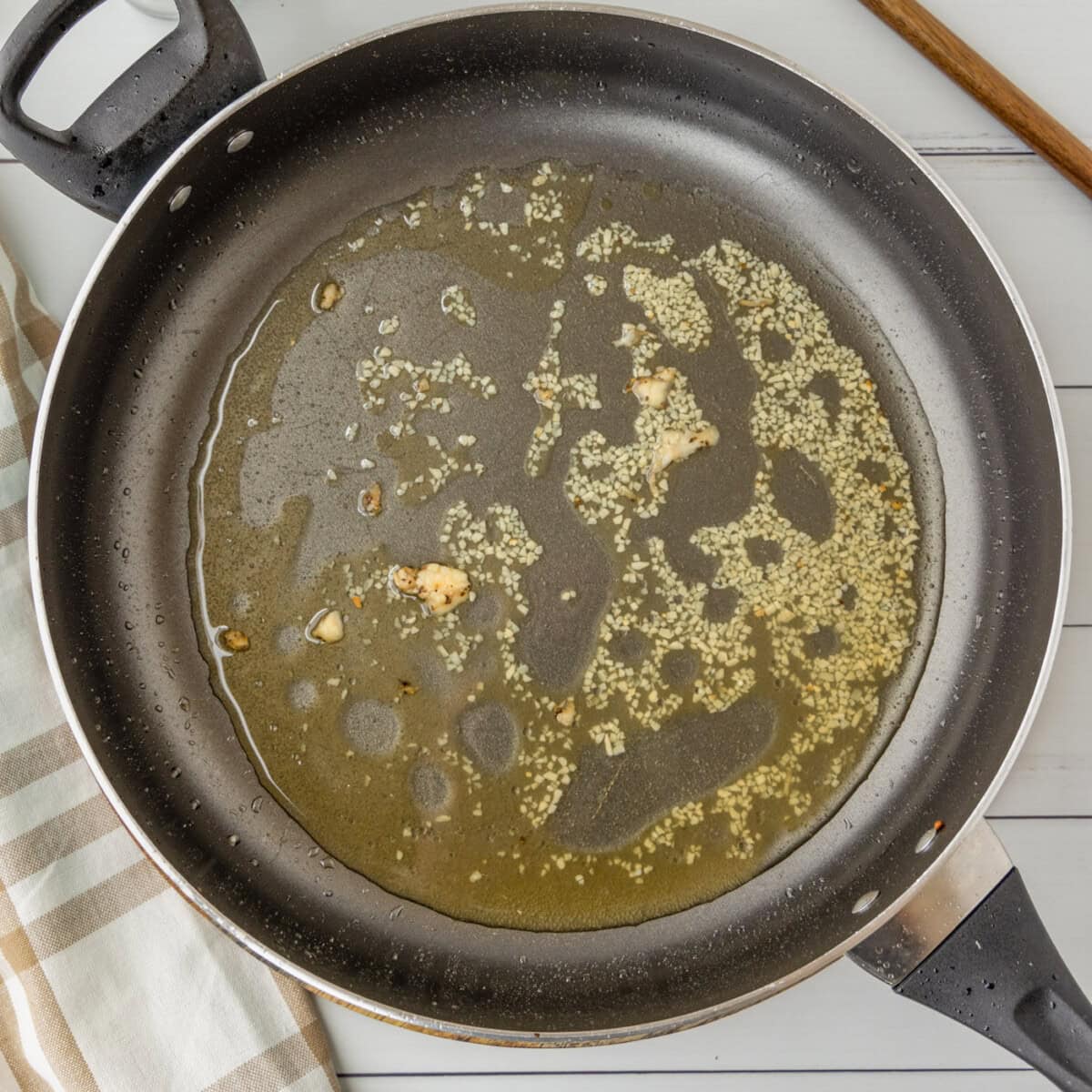 garlic and bourbon in a skillet