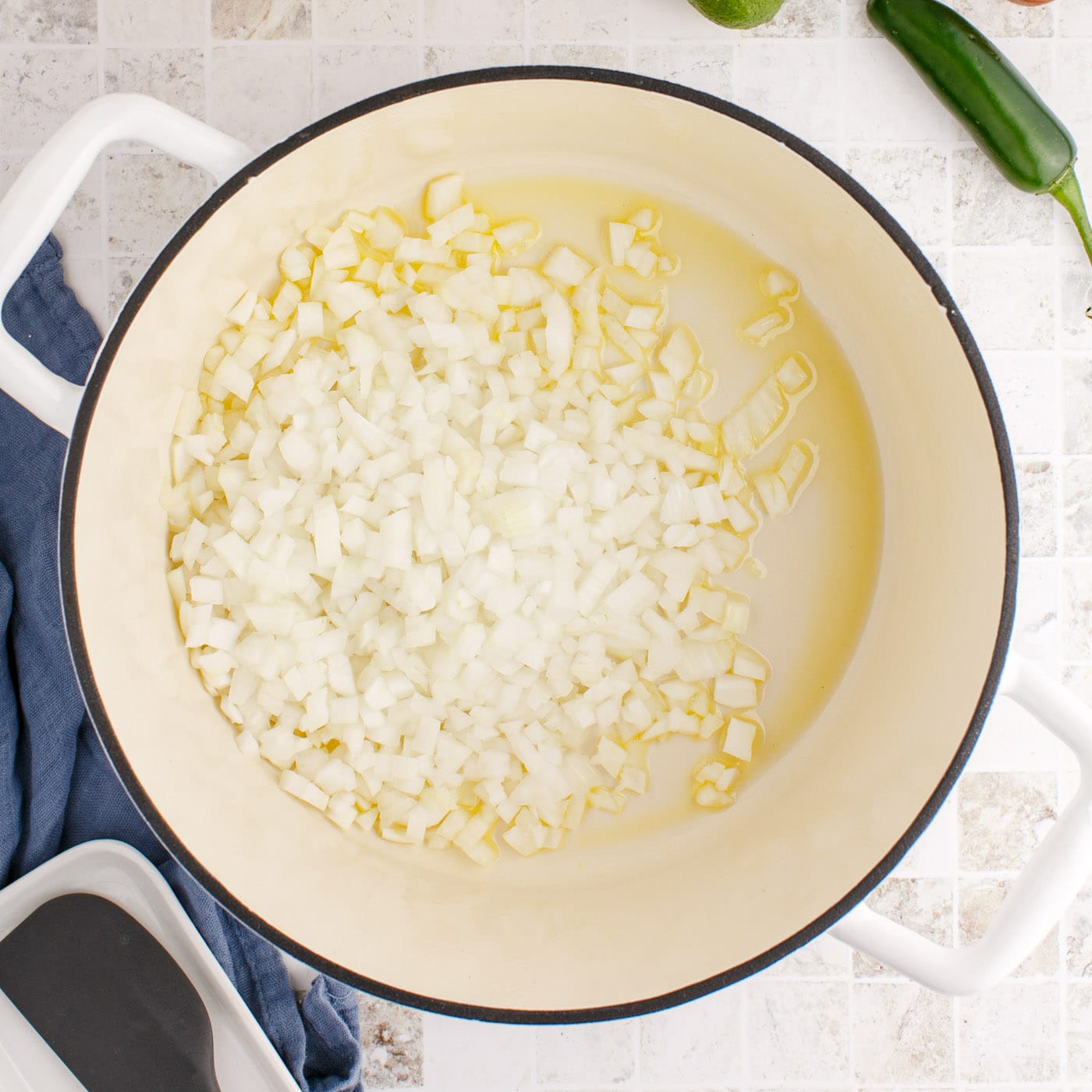 diced onion cooking in oil in dutch oven