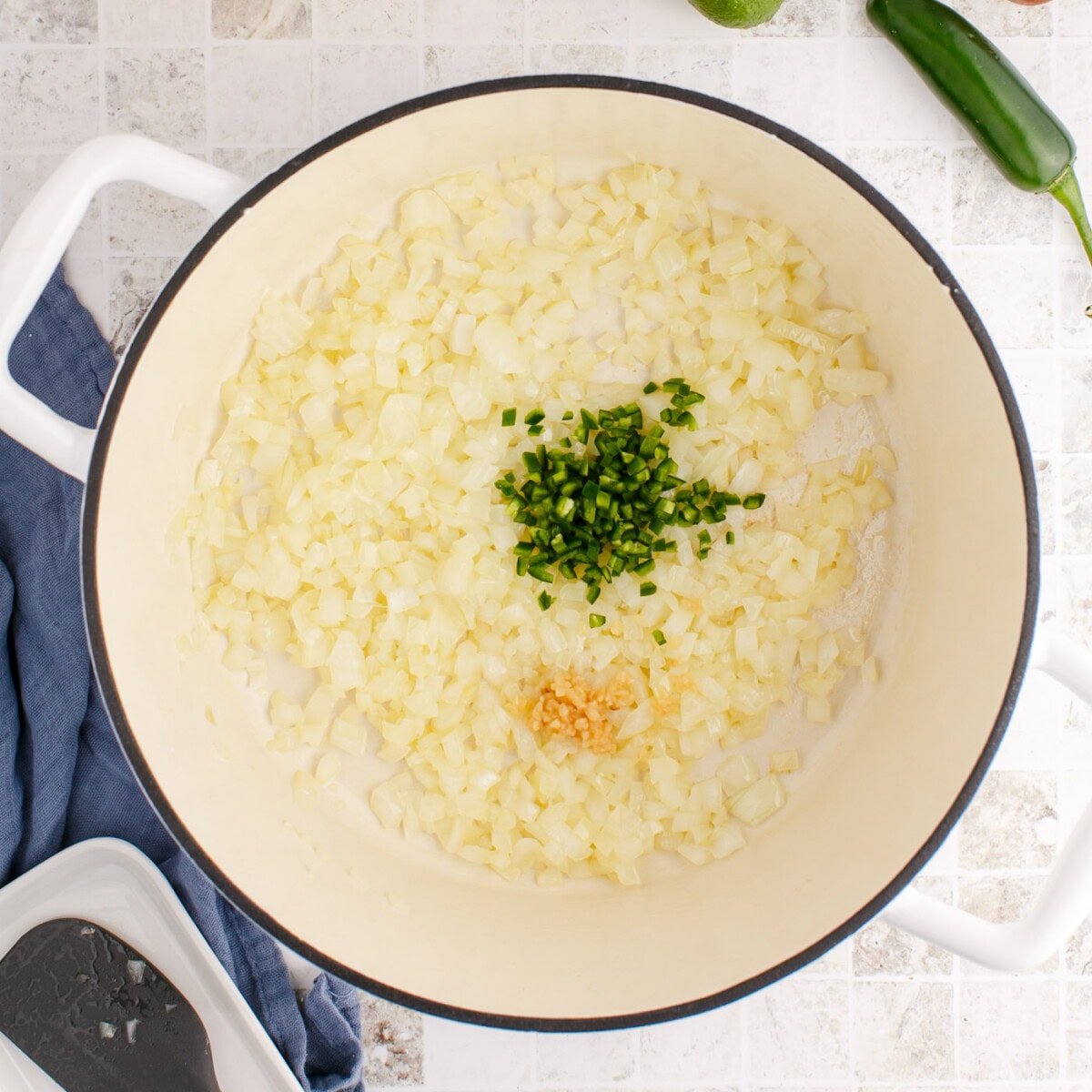 Jalapeno, onion, and garlic in a stockpot