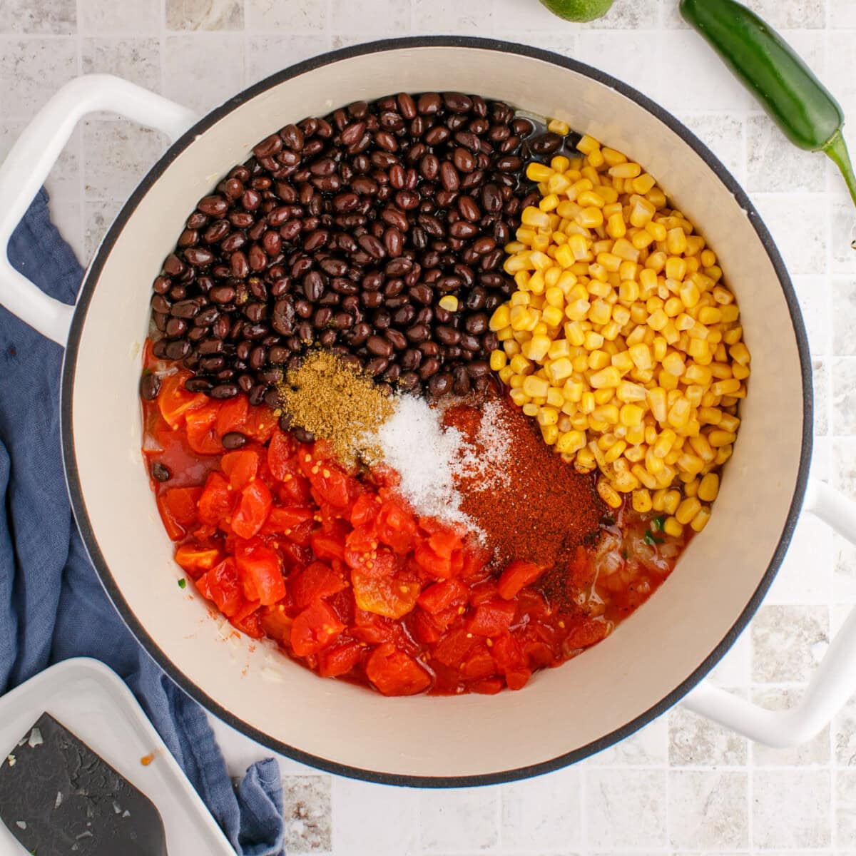 chicken tortilla soup ingredients in a soup pot