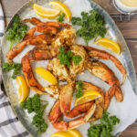 Dungeness Crab Legs on a platter with lemon