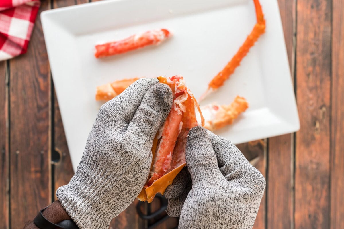 opening crab leg shell and removing meat