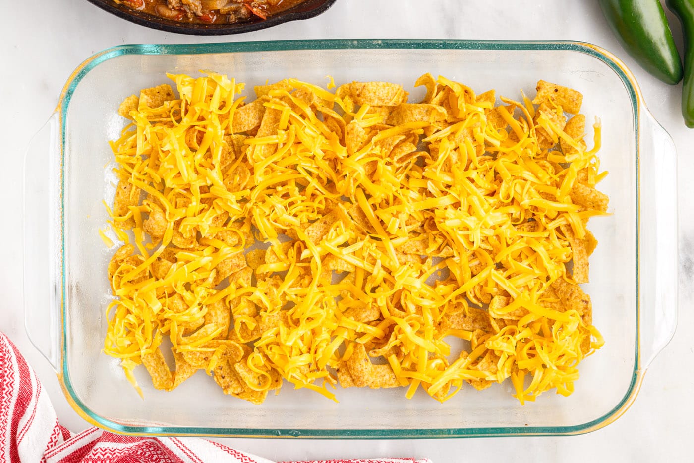Frito chips and cheese in a casserole dish