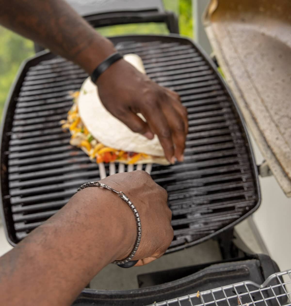 flipping chicken quesadilla on grill