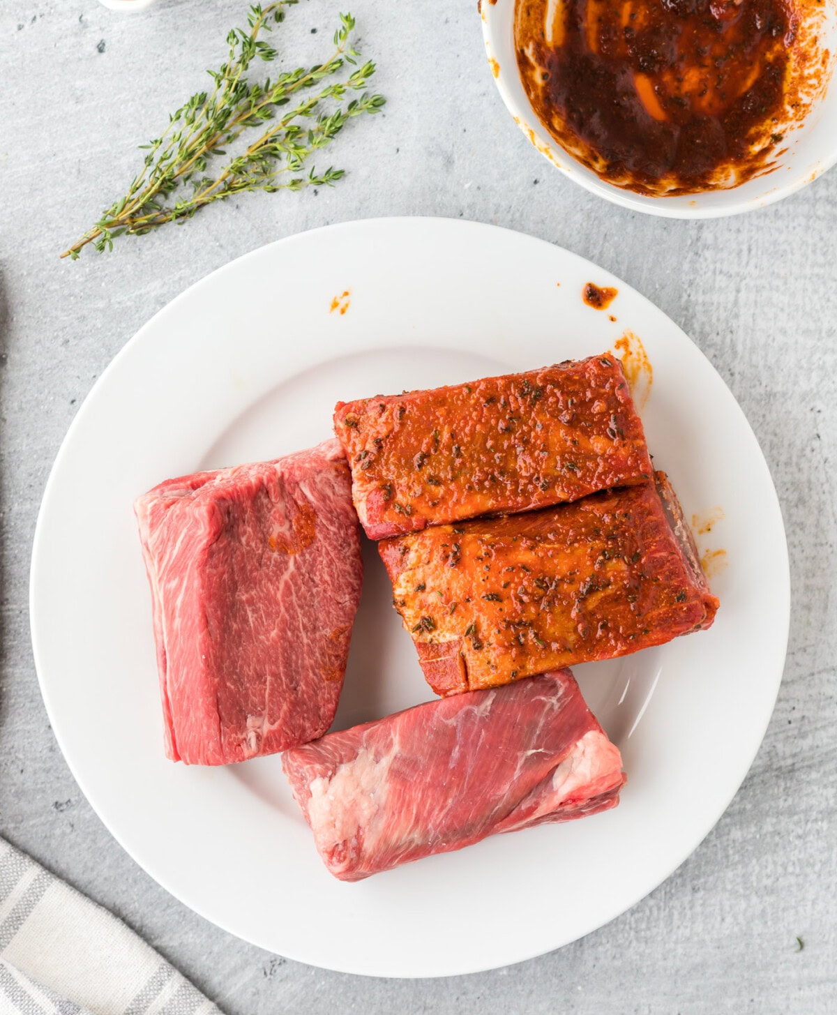 rubbing seasoning into beef short ribs