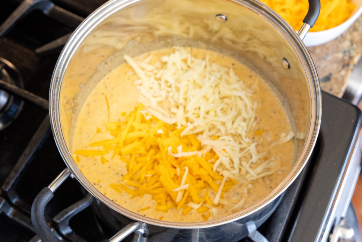 shredded cheese on top of mac and cheese roux
