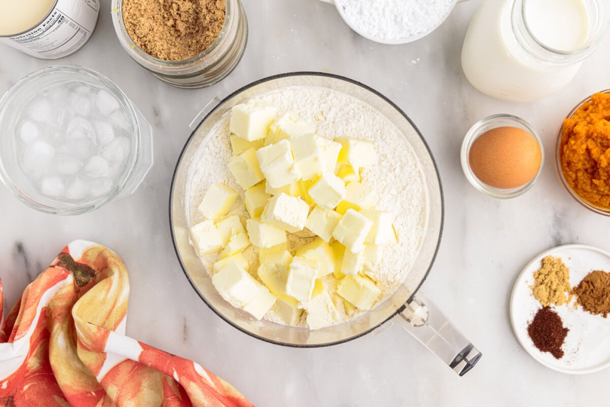 cold butter on top of flour mixture in food processor