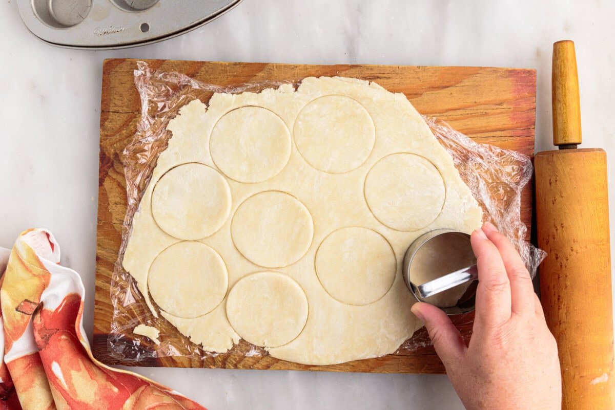 cutting pie dough into small discs