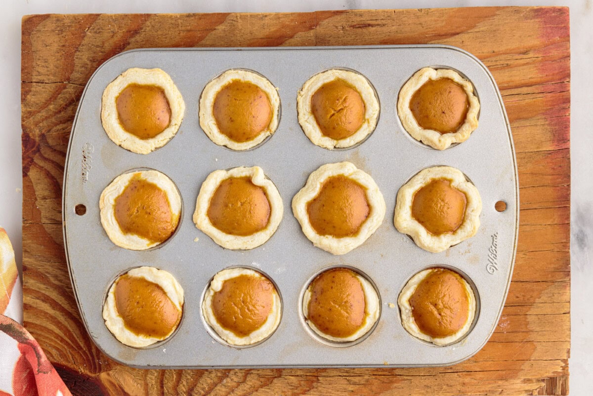 mini pumpkin pies made in a muffin tin