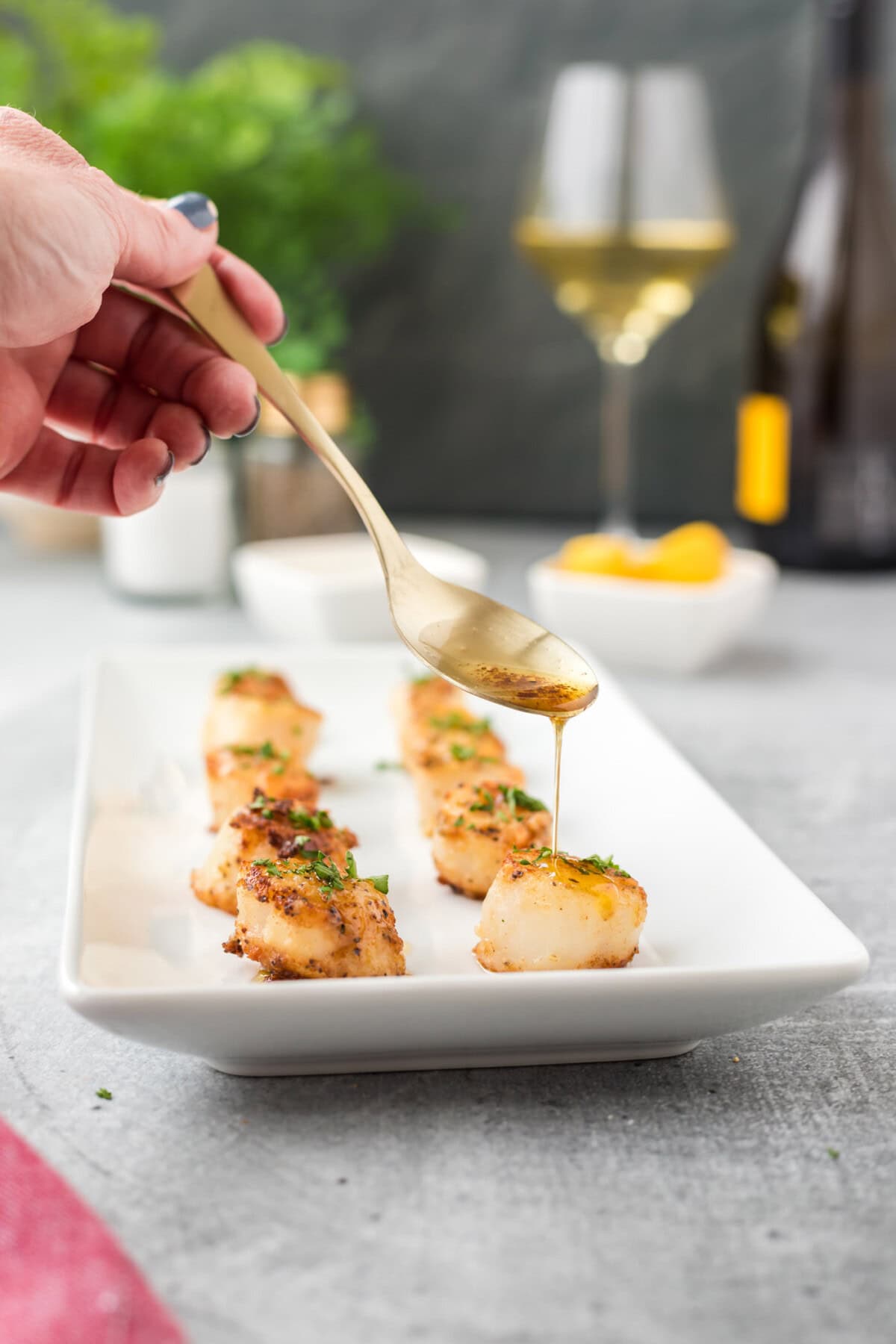 drizzling butter on Pan Seared Scallops