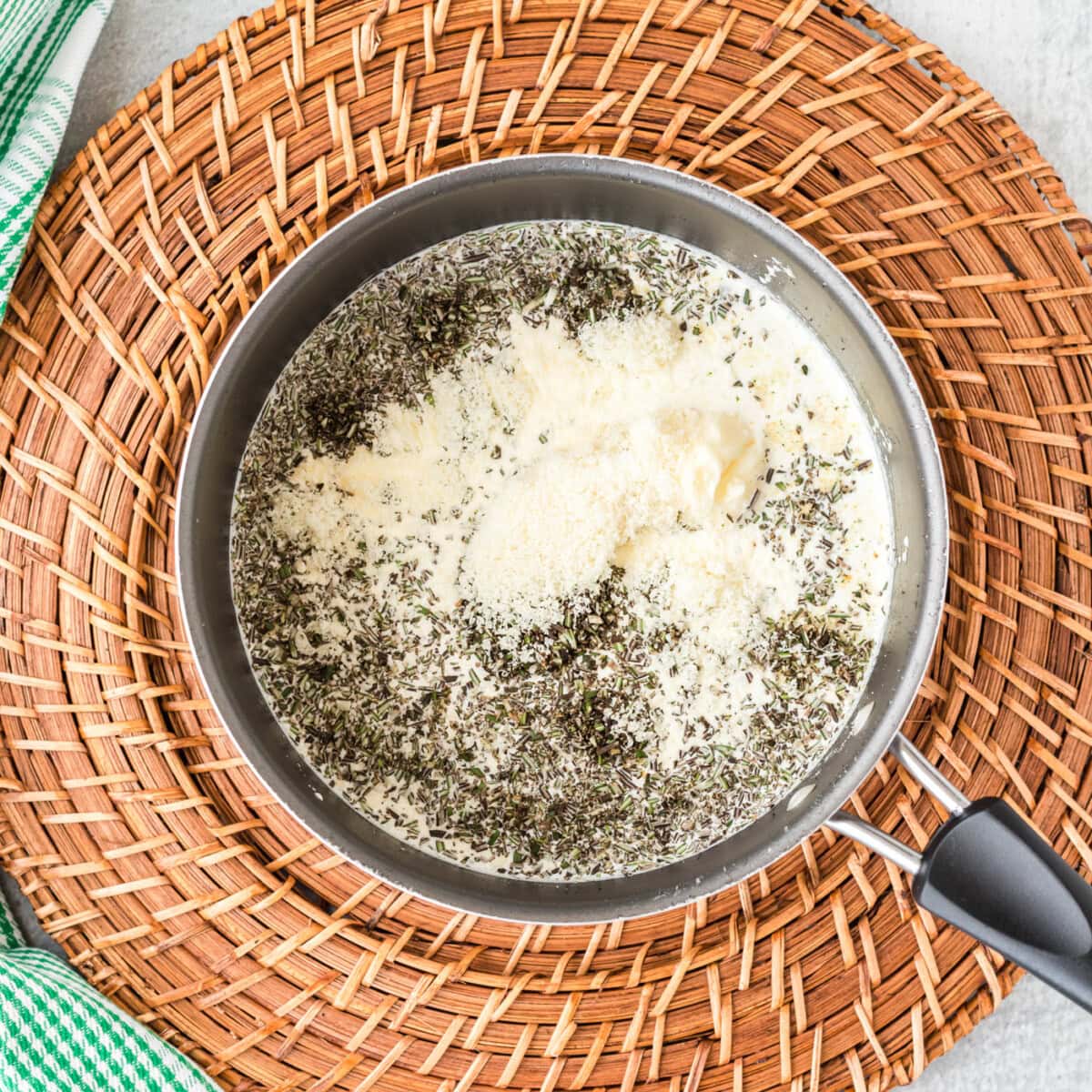 rosemary cream sauce ingredients in a saucepan