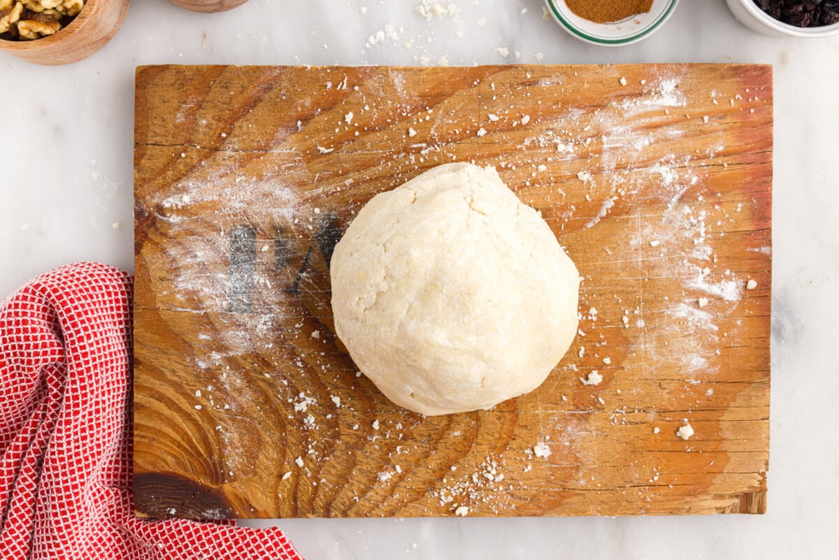 rugelach dough ball on cutting board