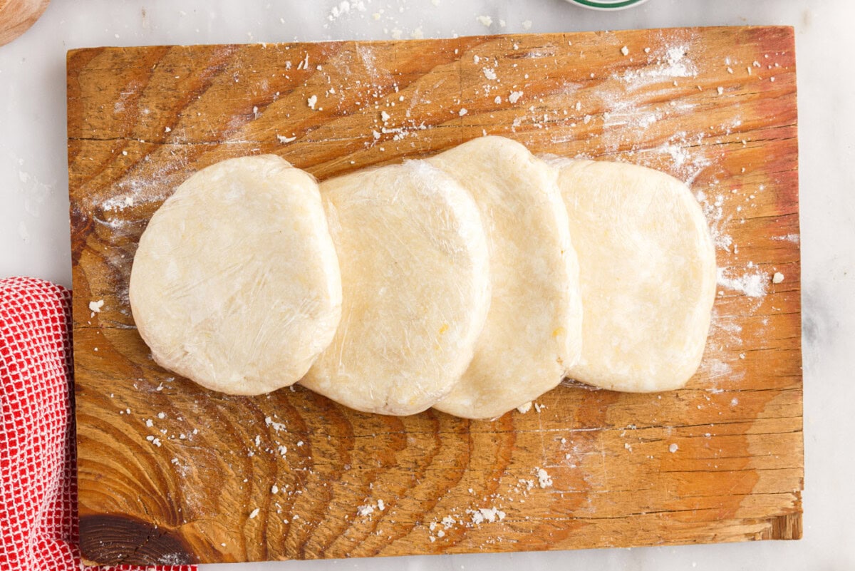 rugelach dough discs on a cutting board