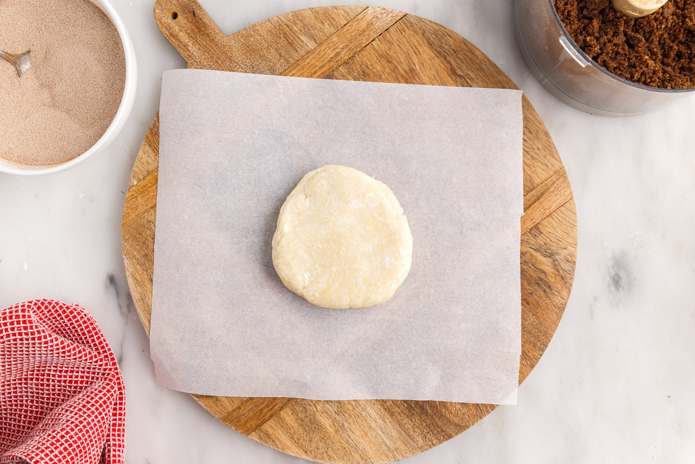 dough disc on parchment paper