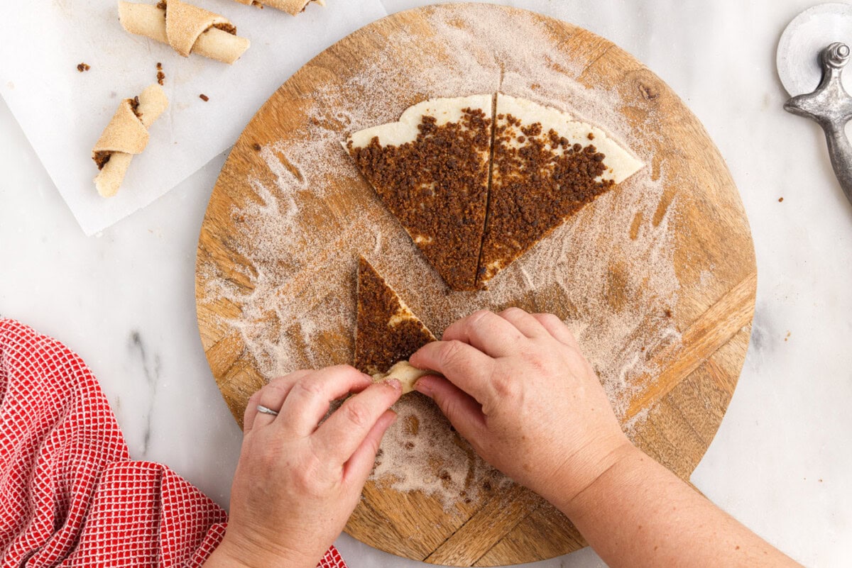 hands rolling rugelach dough