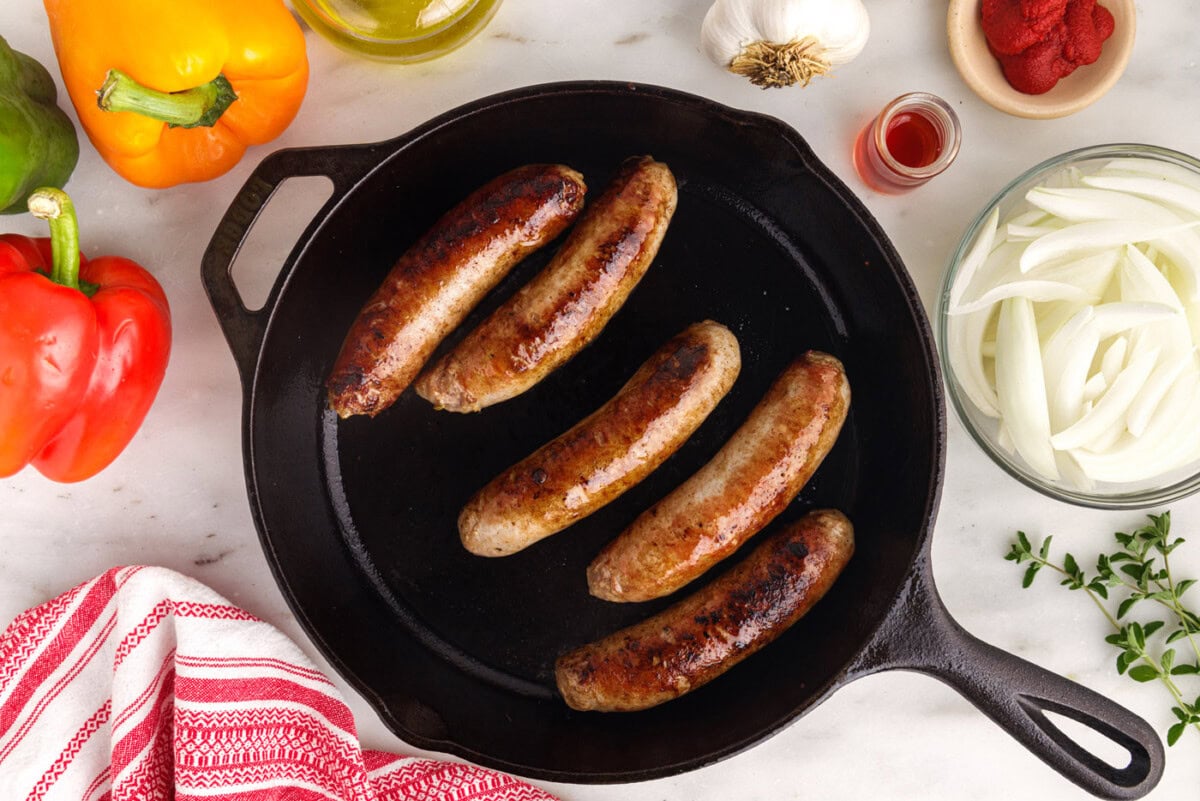 Italian sausage seared in a skillet