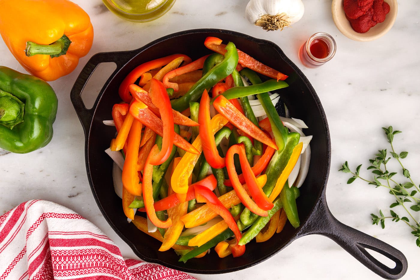 bell peppers and onions in a skillet