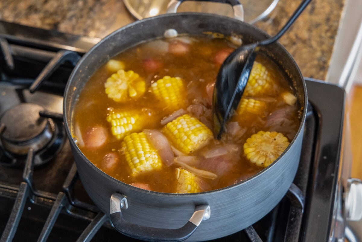 stirring shrimp boil