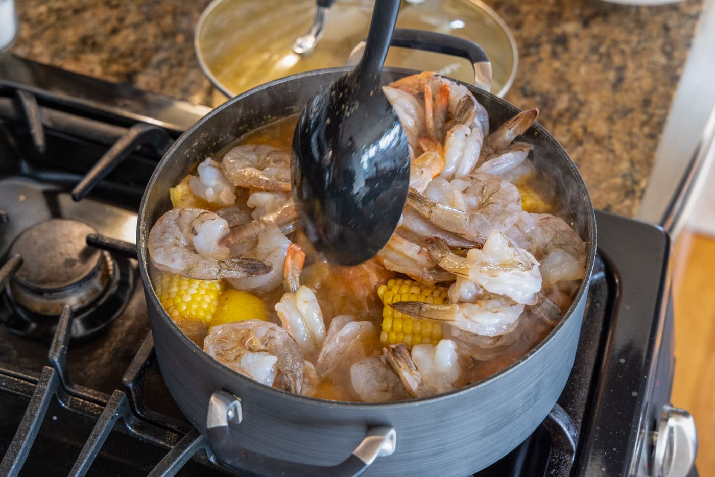 stirring shrimp boil