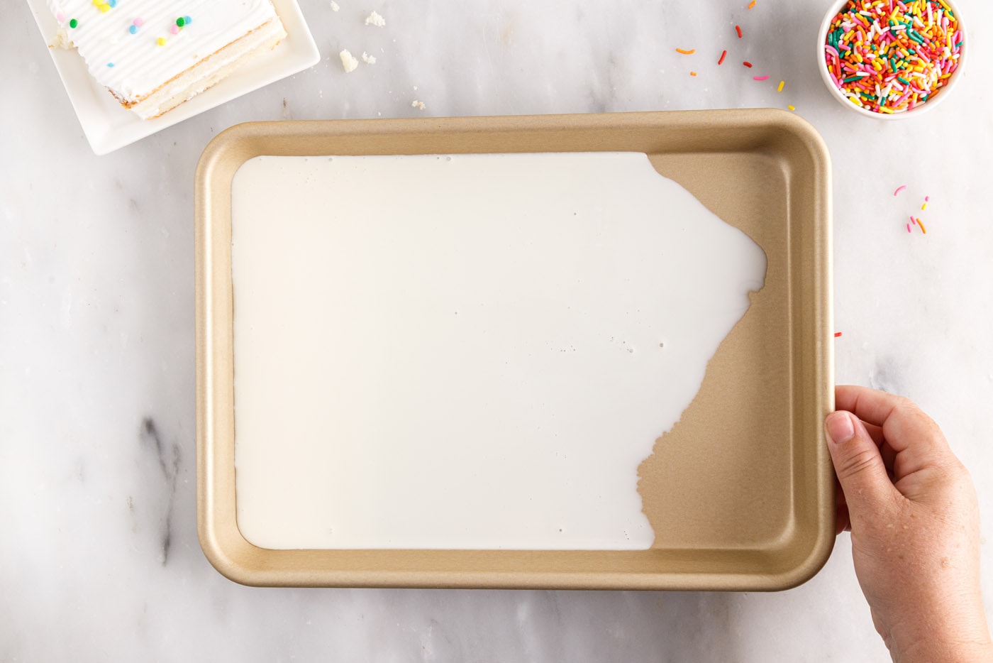 spreading ice cream mixture in a sheet pan