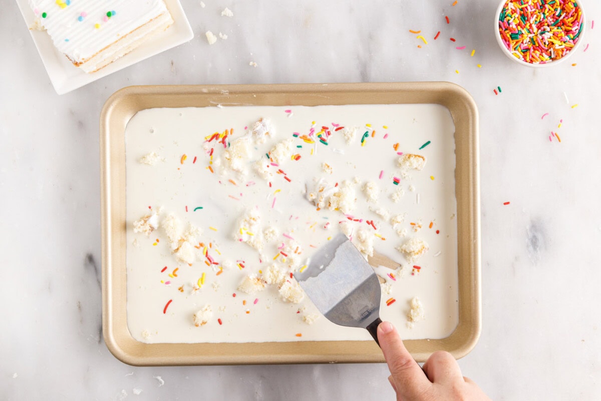 mixing birthday cake ice cream on a pan