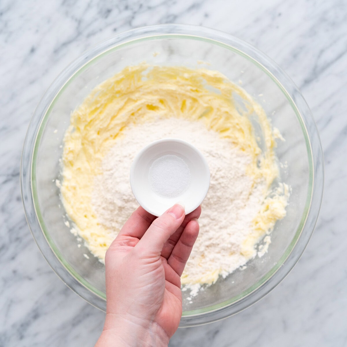 adding salt to flour, butter, and sugar